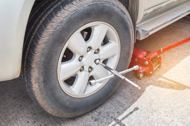 istock Cross wheel wrench changing tire 943229754