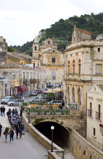 scicli, sicily: young people walking in baroque downtown - scicli imagens e fotografias de stock