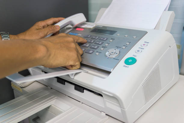 istock Men are using a fax machine in the office. Business concept 943232714