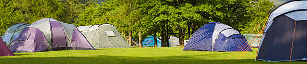 istock Dome tents on rural campsite 94324274