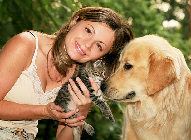 istock Girl with cat and dog 94324782