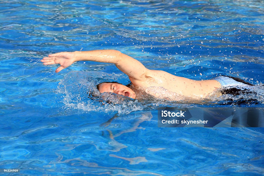 Man swimming in pool  Adult Stock Photo