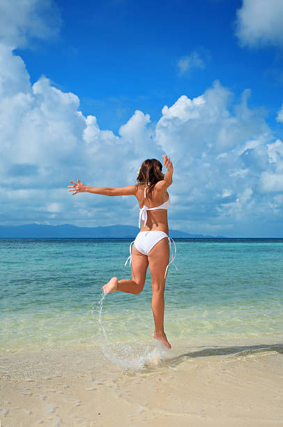 istock Girl running to sea. 94326004