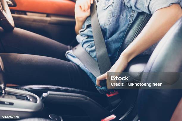 Asian Woman Fastening Seat Belt In The Car Safety Concept Stock Photo - Download Image Now