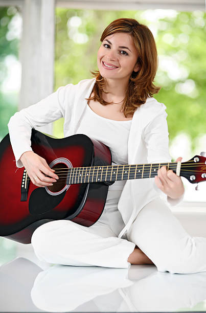 istock Girl with red steel guitar. 94326292