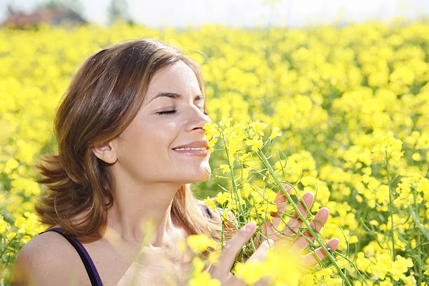 istock Girl swelling yellow flowers. 94326680