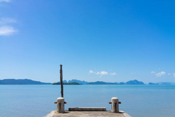 little boat port with islands and blue sky background
