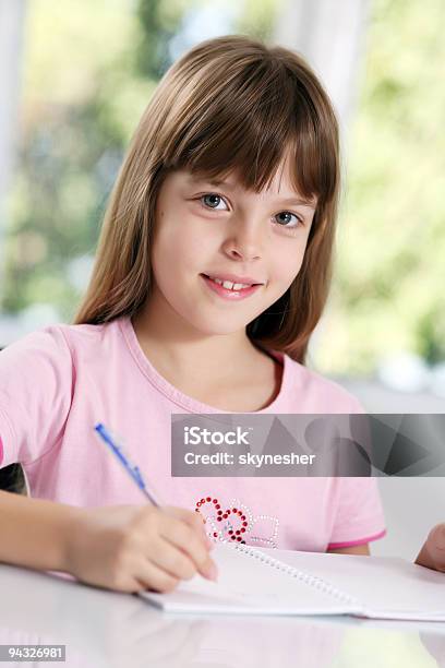 Schoolgirl Learning In Classroom Stock Photo - Download Image Now - Cheerful, Child, Childhood
