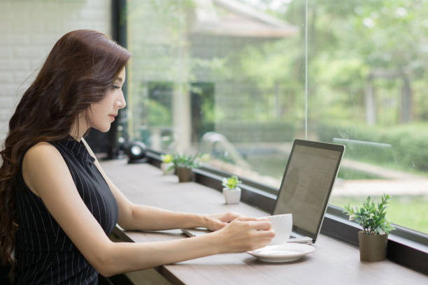istock Young business woman working on laptop at office. 943273864