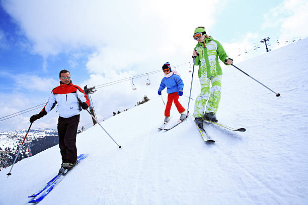 istock Family all together skiing. 94327442
