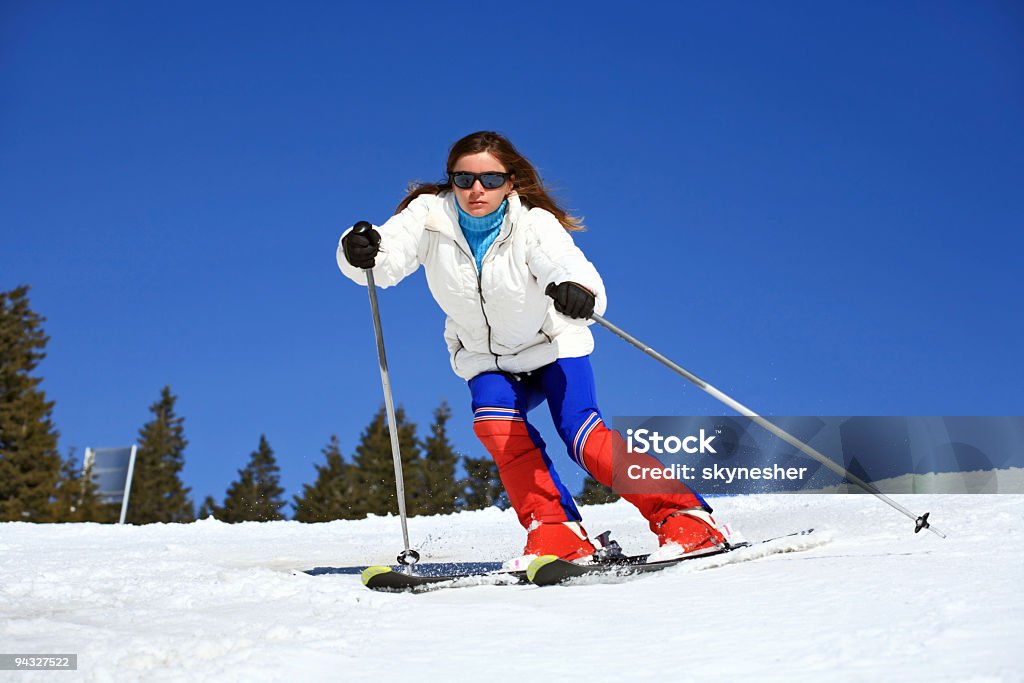 Girl skiing on a slope.  Adult Stock Photo