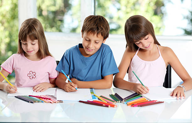 istock Smiling schoolchildren draws a picture. 94327567
