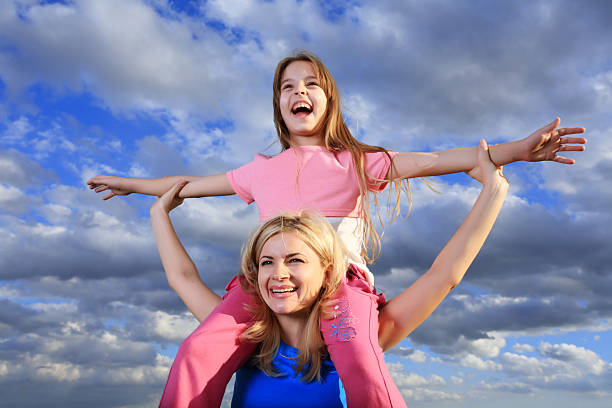 istock Mother with daughter piggyback. 94328027