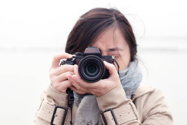 istock girl taking pictures with camera 943281608