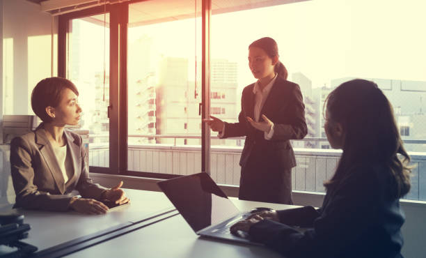 istock Three businesswomen working in the office. Positive workplace concept. 943288584