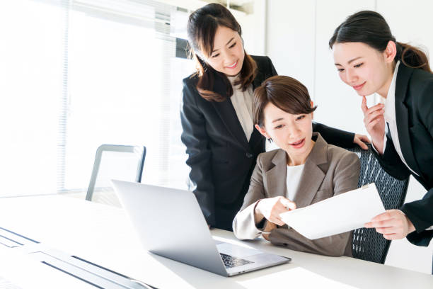 istock Three businesswomen working in the office. Positive workplace concept. 943288590