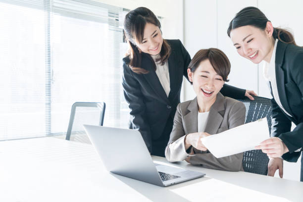 istock Three businesswomen working in the office. Positive workplace concept. 943288604