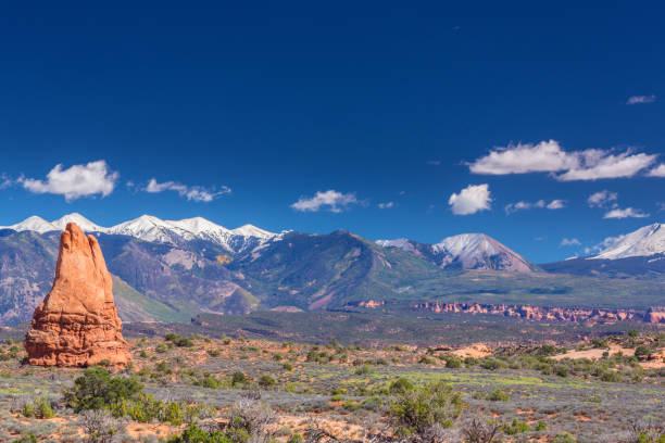 istock Scenery in the Arches National Park, Utah, with Mesa Arch under warm sunrise light 943288802