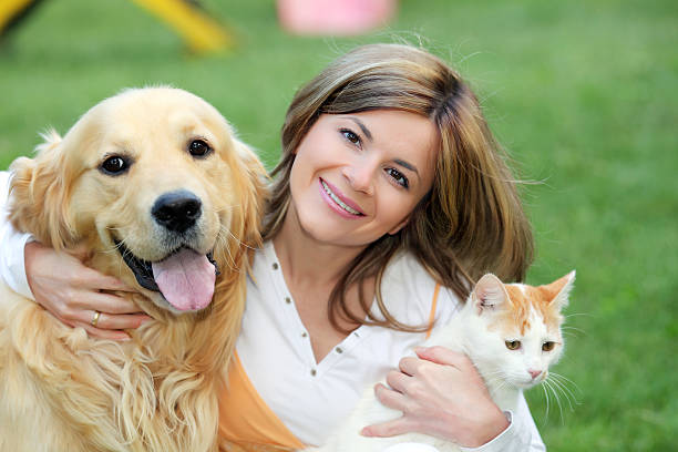 istock Young woman with dog and cat 94328901