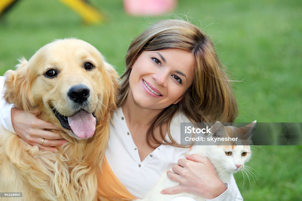 Young woman with dog and cat  Dog Stock Photo