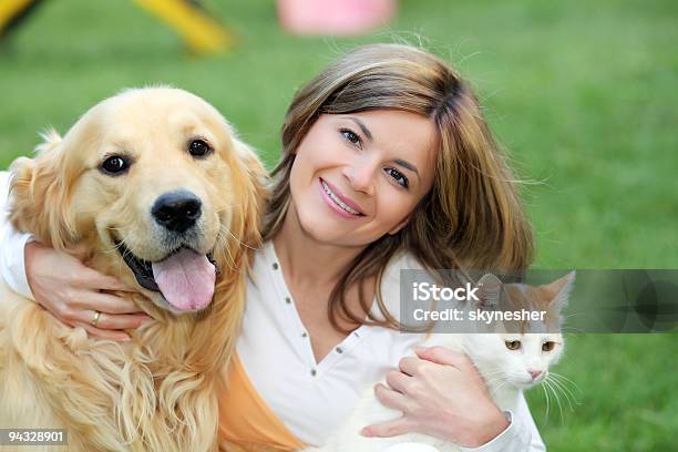 Young Woman With Dog And Cat Stock Photo - Download Image Now - Dog, Domestic Cat, Women