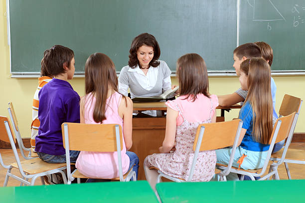 istock School teacher reads story to class. 94328917