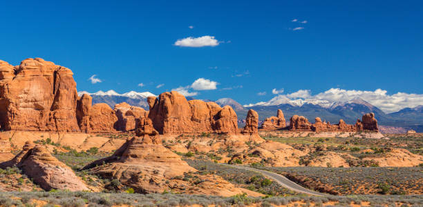 istock Scenery in the Arches National Park, Utah, with Mesa Arch under warm sunrise light 943289538