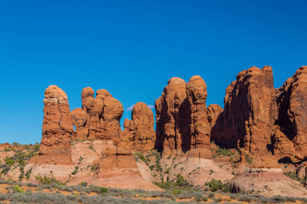 istock Scenery in the Arches National Park, Utah, with Mesa Arch under warm sunrise light 943289842