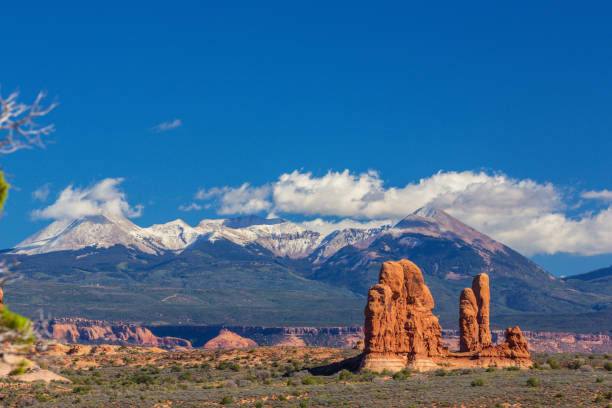 istock Scenery in the Arches National Park, Utah, with Mesa Arch under warm sunrise light 943289844