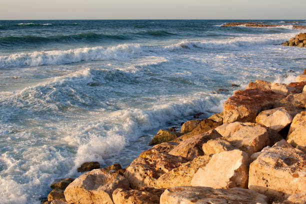 istock splashes of water on the beach 943289946