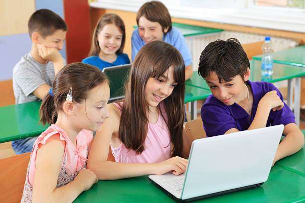 istock Schoolchildren having fun on laptops at  classroom. 94329164