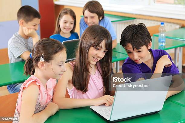 Schoolchildren Having Fun On Laptops At Classroom Stock Photo - Download Image Now