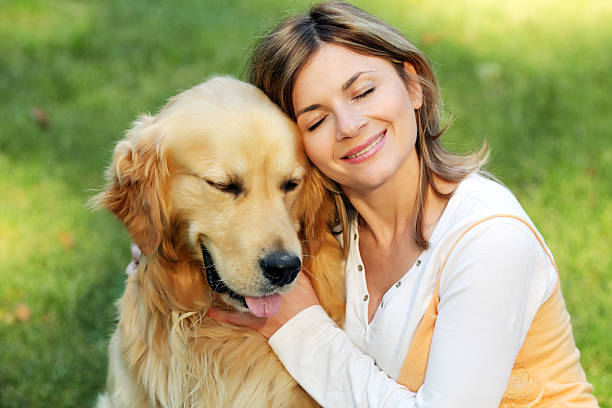 istock Young girl hugging her cute dog. 94329228