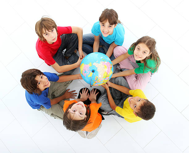 istock Kids holding together a terrestrial globe. 94329731