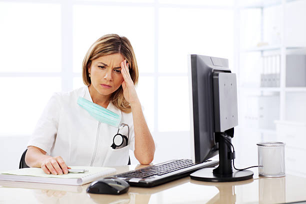 istock Worried female doctor at workplace. 94329790