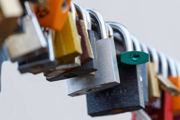 istock Lot of padlocks hanging on bridge. Concept represent forever love 943300064