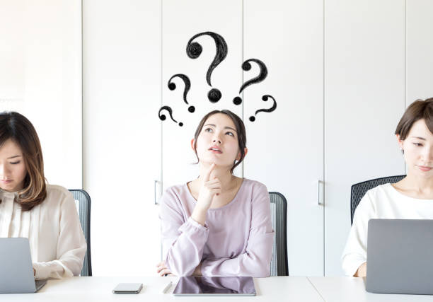 Young asian woman having questions.