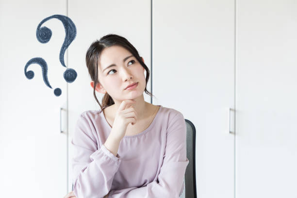istock Young asian woman having questions. 943301044