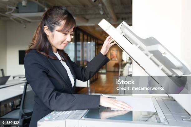 Young Office Girl Holding Documents Stock Photo - Download Image Now - Office, Photocopier, Flat Bed Scanner