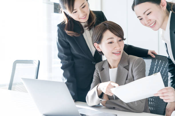 istock Three businesswomen working in the office. Positive workplace concept. 943301364