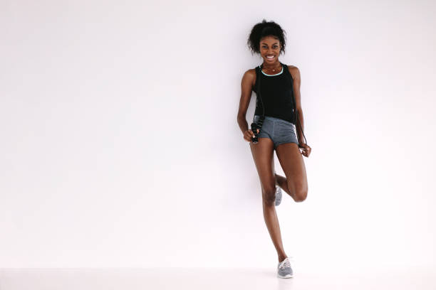 istock Slim and fit woman with jumping rope 943301624