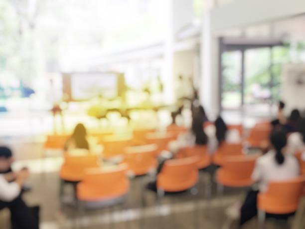 istock blurred image of graduate student playing jazz music at University or high school when Audiences standing for view. learner are show music performance concept 943301856