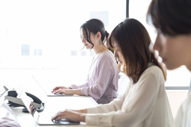 Young asian women working in the office.