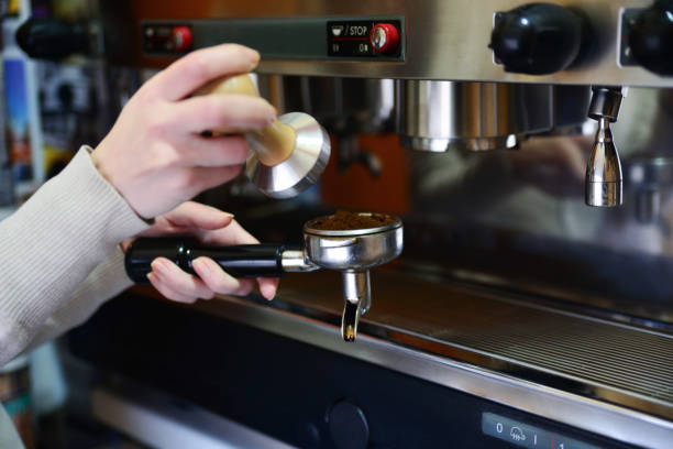 istock Preparation of espresso in electric professional coffee machine 943304770