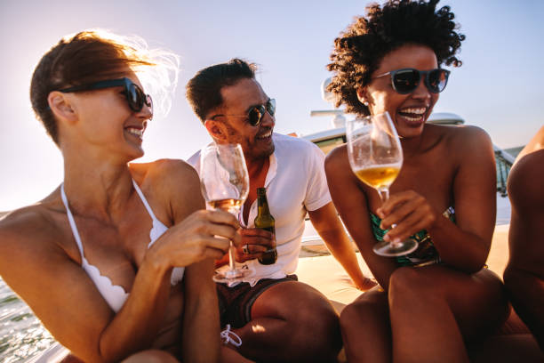 istock Group of friends having a boat party 943310632