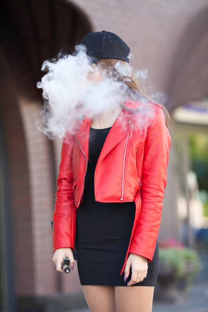 istock Young beautiful woman smoking 943315946