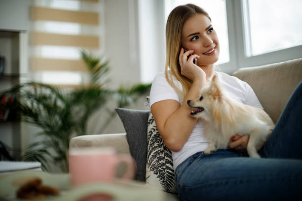 istock Woman talking on the phone at home 943316008