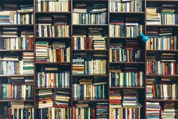 Book shelves in library. Creativity Background Concept