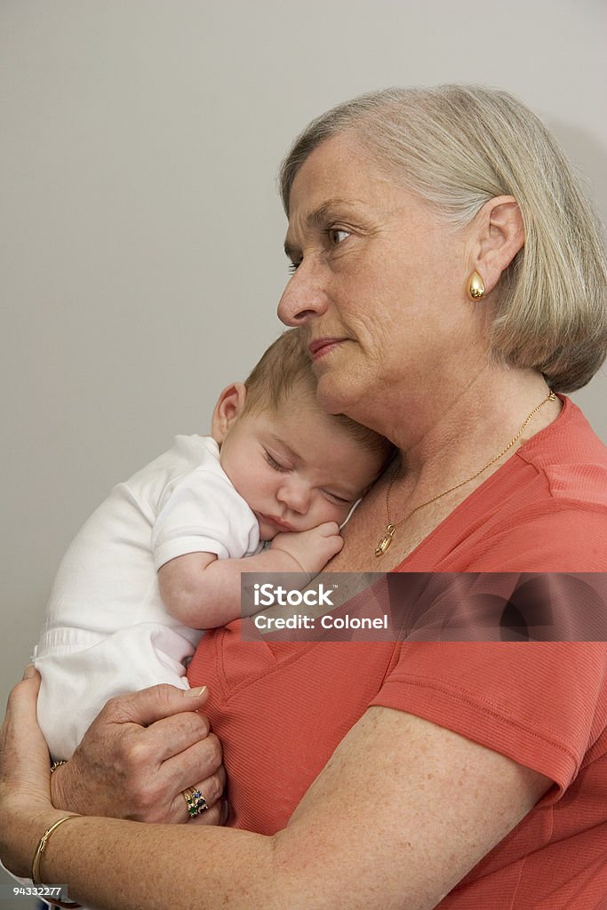 Grandma and sleeping baby  Adult Stock Photo