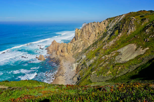 Ocean meets Cliffs of Cabo da Roca Cape Roca in Sintra - the westernmost extent of mainland Portugal and Europe stock photo